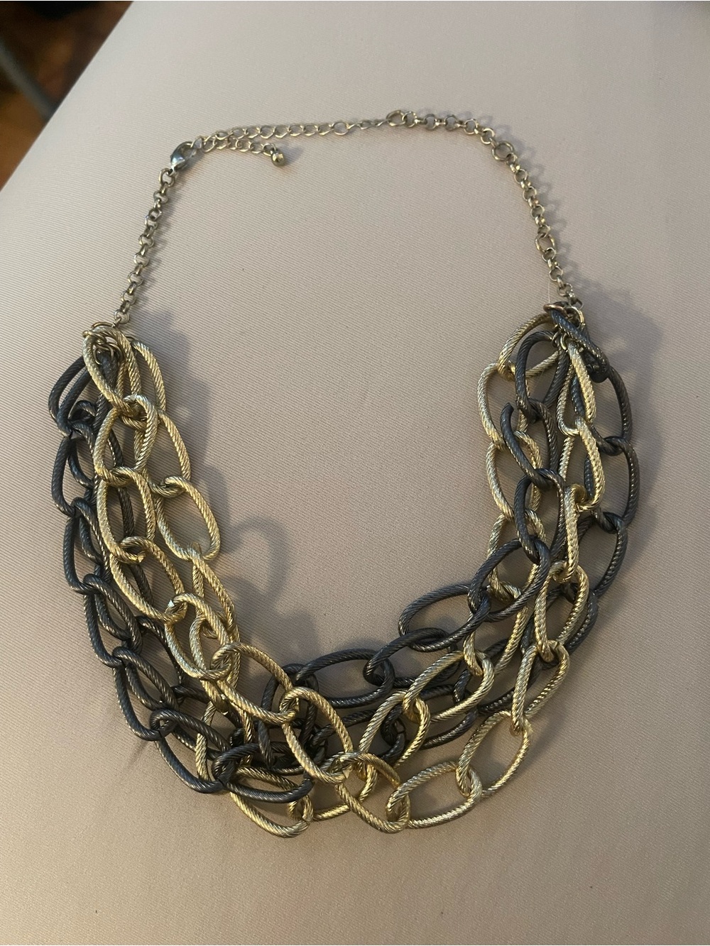 chunky necklace features a multi-layered
